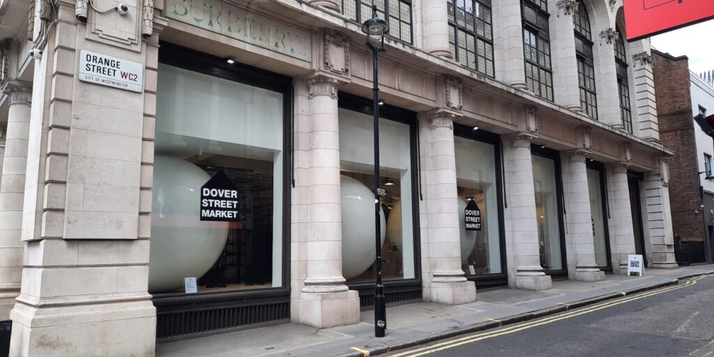 Dover Street Market storefront with stone columns and glass frontage