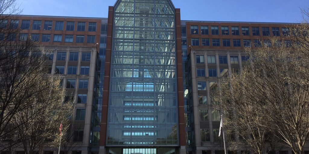Modern brick Patent Office building with glass atrium center