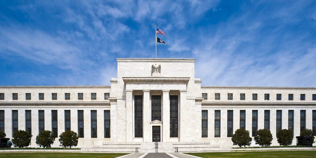 The Eccles Building, Federal Reserve headquarters, under a clear blue sky